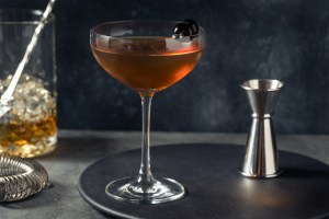 Boozy Refreshing Bourbon Manhattan Cocktail with Cherry Garnish